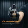 borophene-coating-Motor-Headz-00008 Extreme close-up of Borophone Coating in a 30ml bottle held by a person wearing black gloves, highlighting durability for motorbike protection.